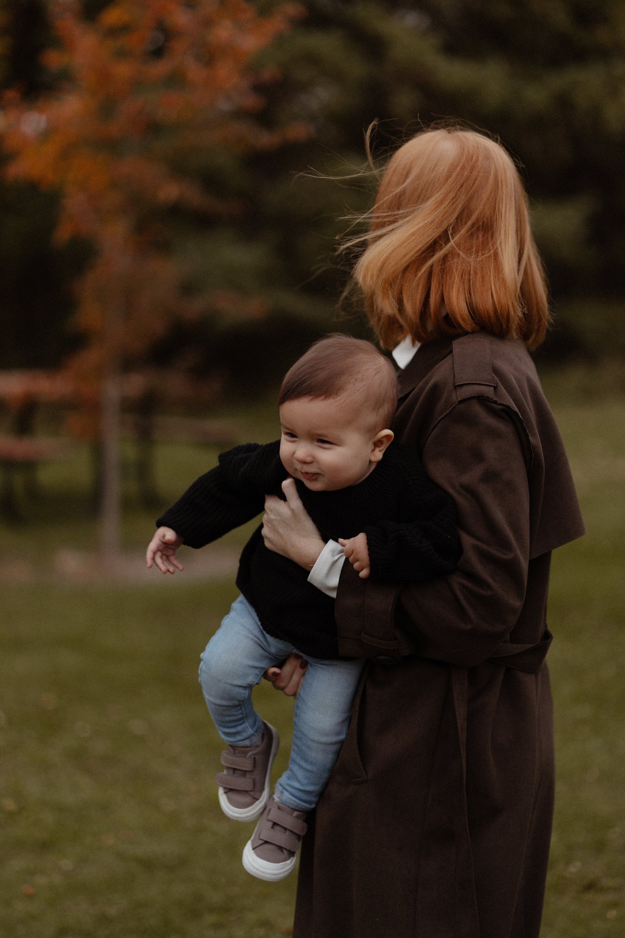 Alina holding her younger child during the autumn family session.