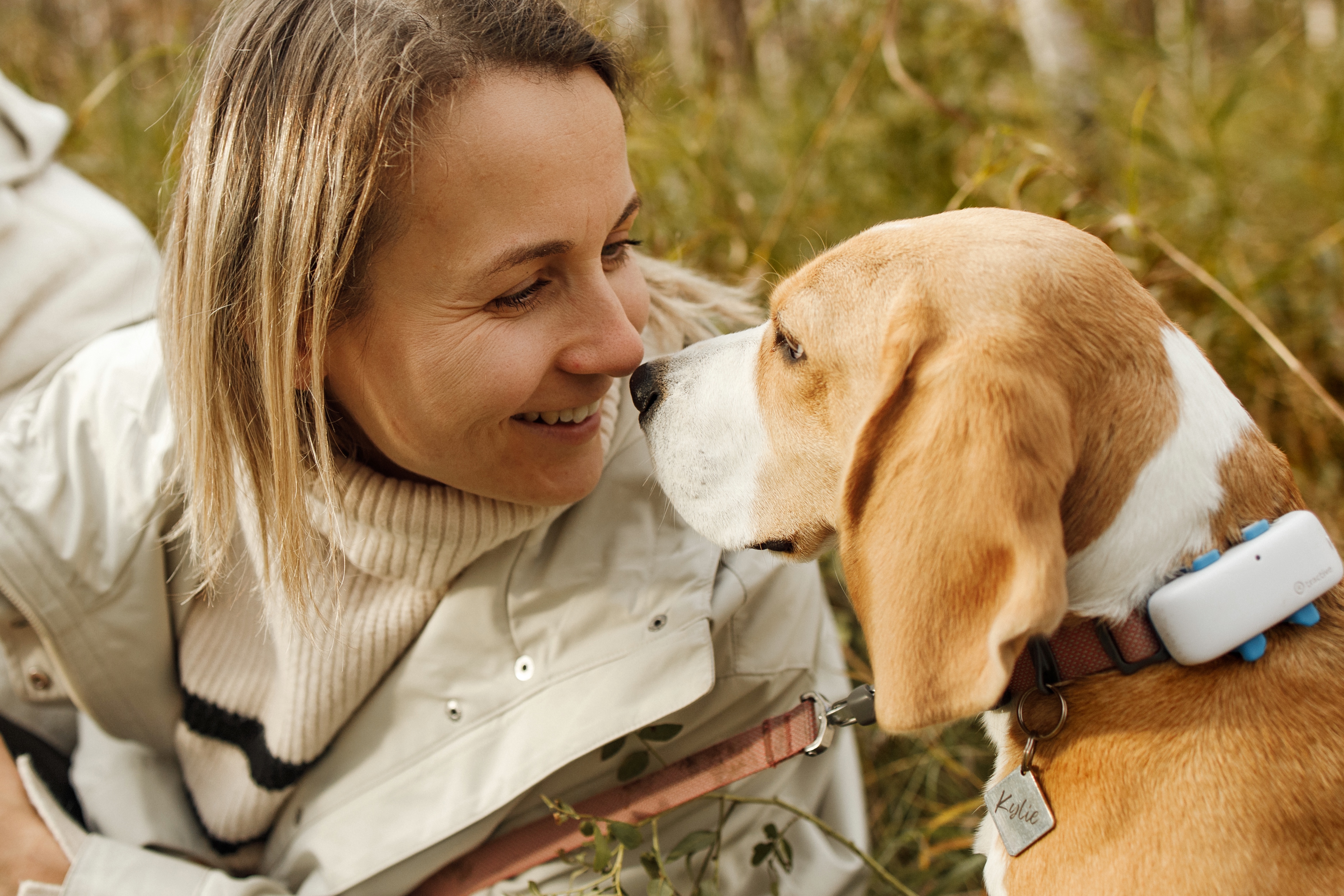 Family connection with a dog during a Winnipeg outdoor photo session.