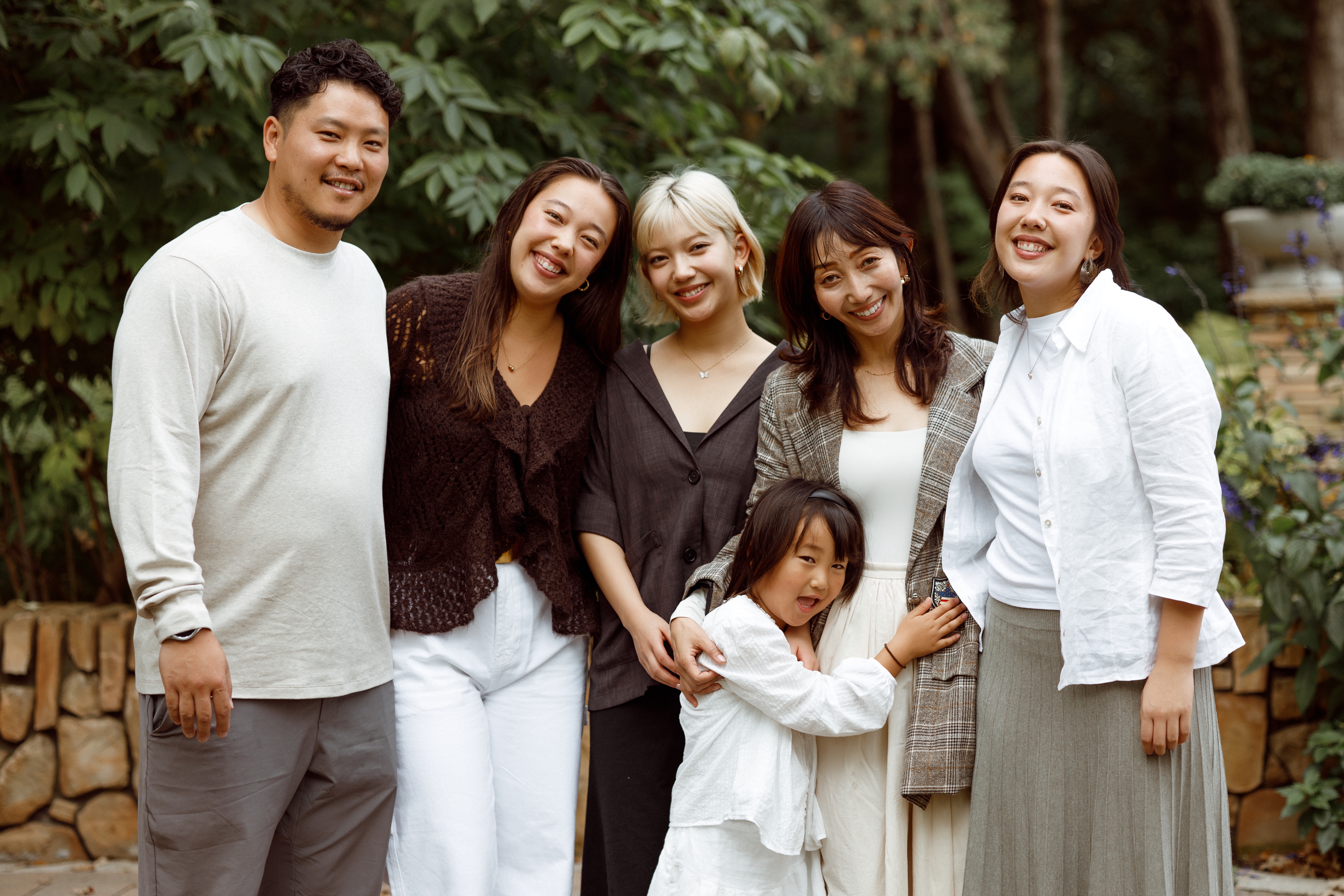 Mie’s family walking together in a Winnipeg outdoor session.