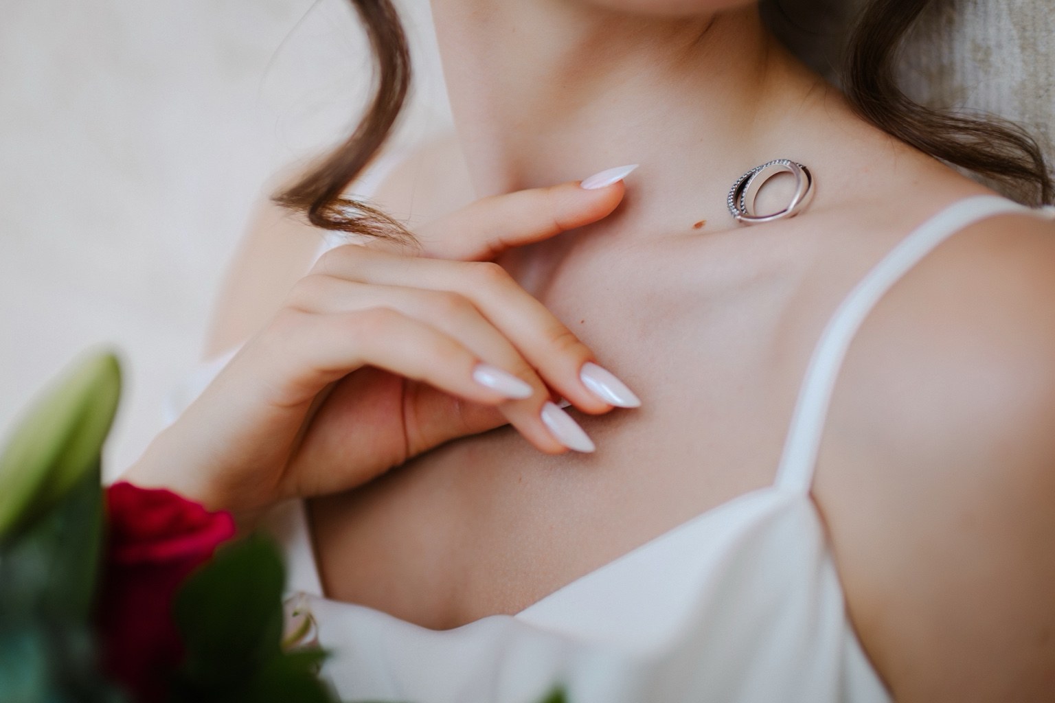 Bride holding wedding rings